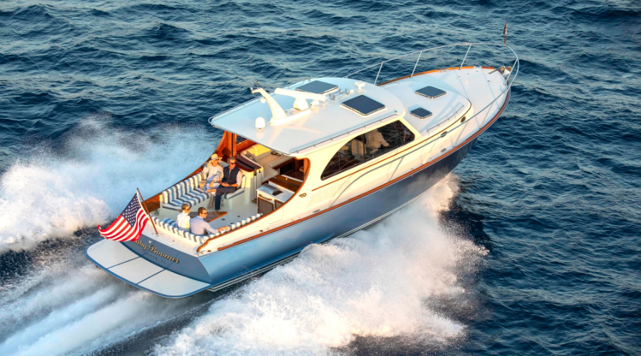 Hinckley luxury motor yacht underway on open water with an Awlgrip® premium finish.