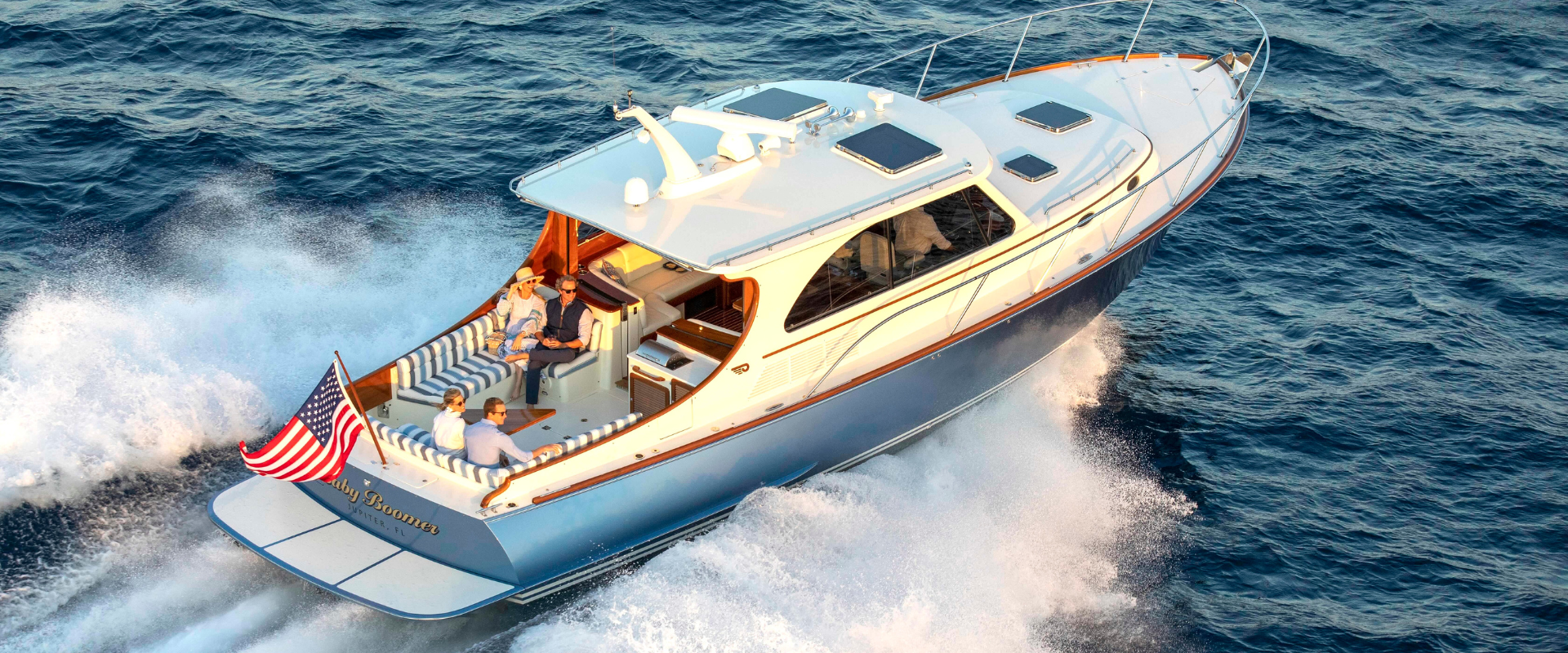 Hinckley luxury motor yacht underway on open water with an Awlgrip® premium finish.